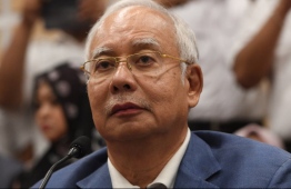 Former Malaysian prime minister Najib Razak attends a press conference to announce his resignation as president of the United Malays National Organisation (UMNO), the main component party of the defeated Barisan Nasional (BN) coalition, in Kuala Lumpur on May 12, 2018.
Malaysia's defeated leader Najib Razak on May 12 announced he was quitting as head of the Barisan Nasional coalition and its main party after leading the coalition to a shock loss. / AFP PHOTO / ROSLAN RAHMAN
