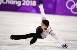 Japan's Yuzuru Hanyu competes in the men's single skating free skating of the figure skating event during the Pyeongchang 2018 Winter Olympic Games at the Gangneung Ice Arena in Gangneung on February 17, 2018. / AFP PHOTO / Roberto SCHMIDT