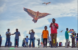 Male: People fly kites at the helipad site on the southern coast of the capital city; kite flying has long been a form of entertainment during the month of Ramadan in the Maldives. PHOTO: HUSSAIN WAHEED/MIHAARU