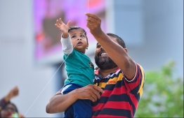 Male: People fly kites at the helipad site on the southern coast of the capital city; kite flying has long been a form of entertainment during the month of Ramadan in the Maldives. PHOTO: HUSSAIN WAHEED/MIHAARU