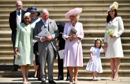 (L-R) Meghan Markle's mother Doria Ragland, Britain's Prince Charles, Prince of Wales, Britain's Camilla, Duchess of Cornwall, Princess Charlotte and Britain's Catherine, Duchess of Cambridge leave the wedding ceremony of Britain's Prince Harry, Duke of Sussex and US actress Meghan Markle at St George's Chapel, Windsor Castle, in Windsor, on May 19, 2018. Ben STANSALL / POOL / AFP