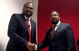 Ali Waheed shakes hands with JP leader Qasim Ibrahim during a rally held in Germany. PHOTO/SOCIAL MEDIA