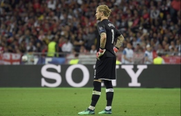 Liverpool's German goalkeeper Loris Karius reacts during the UEFA Champions League final football match between Liverpool and Real Madrid at the Olympic Stadium in Kiev, Ukraine on May 26, 2018. / AFP PHOTO / LLUIS GENE