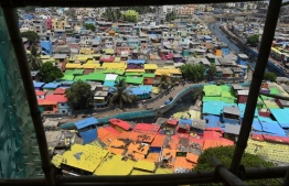 This aerial picture taken on June 2, 2018 shows a view of houses painted in bright colours at a fishing area in Mumbai.
Mumbai's slums are getting a colourful makeover thanks to an organisation that aims to change how people perceive deprived areas in India's financial capital. / AFP PHOTO / PUNIT PARANJPE