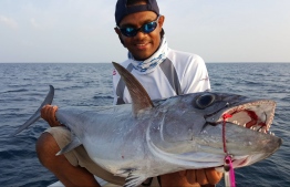 Abdulla Anif poses with a catch. PHOTO/ADDU SPORT FISHING