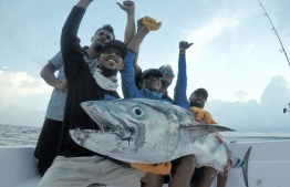Abdulla Anif (C) pictured during a sports fishing excursion. PHOTO/ADDU SPORT FISHING