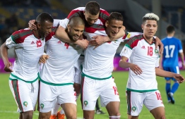 Morocco's team celebrates the second goal during their international friendly football match between Morocco and Uzbekistan at the Mohammed V Casablanca Stadium in Casablanca on March 27, 2018. / AFP PHOTO / FADEL SENNA