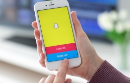 A user logging into Snapchat. The online application became the latest social network moving to curb the reach of US President Donald Trump, claiming the president has been inciting "racial violence." PHOTO: MIHAARU FILES
