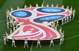 Actors perform during the opening ceremony before the Russia 2018 World Cup Group A football match between Russia and Saudi Arabia at the Luzhniki Stadium in Moscow on June 14, 2018. / AFP PHOTO / Mladen ANTONOV / 