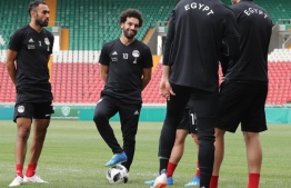 Egypt's forward Mohamed Salah (2nd-L) and Egypt's defender Ahmed Elmohamady (L) attend a training session during the Russia 2018 World Cup football tournament at the Akhmat Arena stadium in Grozny on June 17, 2018. / AFP PHOTO / KARIM JAAFAR