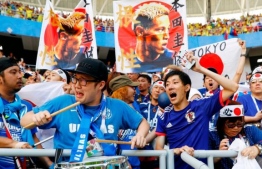 އިއްޔެ ޖަޕާނާއި ކޮލަމްބިއާ ބައްދަލުކުރި މެޗުގެ ތެރެއިން ޖަޕާނުގެ ސަޕޯޓަރުން އުފާފާޅުކުރުމުގައި. ޖަޕާނު މޮޅުވީ 2-1 އިން - ފޮޓޯ: އޭއެފްޕީ