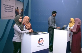 Employees of Maldives Pension Administration Office at an event held to provide information about the Retirement Pension Scheme. PHOTO: MIHAARU