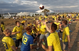 Swedish football fans celebrate midsummer outside the Fisht Olympic stadium in Sochi on June 22, 2018, on the eve of the Russia 2018 FIFA World Cup Group F football match between Germany and Sweden. / AFP PHOTO / Adrian DENNIS