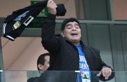 Argentina's football legend Diego Maradona gestures in the grandstand before the Russia 2018 World Cup Group D football match between Argentina and Croatia at the Nizhny Novgorod Stadium in Nizhny Novgorod on June 21, 2018. / AFP PHOTO / Dimitar DILKOFF / 