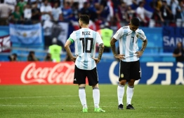 Argentina's forward Lionel Messi (L) and Argentina's midfielder Ever Banega react to their loss during the Russia 2018 World Cup round of 16 football match between France and Argentina at the Kazan Arena in Kazan on June 30, 2018. / AFP PHOTO / Jewel SAMAD / 