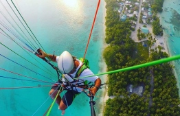 Soar through the sky over the glittering jewel tones of Maldives’ archipelago, sun-kissed by the warm tropical rays with Maldives Paragliding. PHOTO/ MALDIVES PARAGLIDING