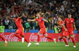 England's team players celebrate after winning  at the end of to the Russia 2018 World Cup round of 16 football match between Colombia and England at the Spartak Stadium in Moscow on July 3, 2018. / AFP PHOTO / FRANCK FIFE / 