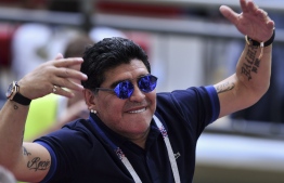 Argentinian former football player Diego Armando Maradona  reacts during the Russia 2018 World Cup round of 16 football match between France and Argentina at the Kazan Arena in Kazan on June 30, 2018. / AFP PHOTO / SAEED KHAN / 