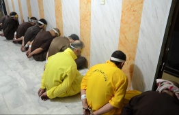 EDITORS NOTE: Graphic content / A handout picture released by the Iraqi Justice Ministry on June 29, 2018 shows blindfolded and handcuffed jihadists of the Islamic State group who have been condemned to death waiting for their sentences to be executed.
Iraq executed a dozen death row jihadists on the order of Prime Minister Haider al-Abadi, his office said today, in retaliation for the Islamic State group's execution of eight captives. The executions on June 28 came shortly after Abadi ordered the "immediate" implementation of the death sentences of hundreds of convicted jihadists in response to the killings by IS.
 / AFP PHOTO / Iraq Justice Minister / Handout / XGTY /  == RESTRICTED TO EDITORIAL USE - MANDATORY CREDIT "AFP PHOTO / HO / Iraq Justice Ministry" - NO MARKETING NO ADVERTISING CAMPAIGNS - DISTRIBUTED AS A SERVICE TO CLIENTS ==