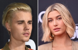 (FILES:) These two file photos show singer Justin Bieber (L) on February 10, 2016 attending the Yves Saint Laurent men's fall line at the Hollywood Palladium in Hollywood, California; and TV personality-model Hailey Baldwin (R) on May 20, 2018 at the 2018 Billboard Music Awards at the MGM Grand Resort International in Las Vegas, Nevada.
Trouble-prone pop star Justin Bieber will be a married man after popping the question to model Hailey Baldwin whom he has dated for one month, reports said on Sunday, July 8, 2018. The 24-year-old Canadian heartthrob, who has become better known for his off-stage antics, proposed to the 21-year-old over dinner Saturday night at a restaurant in The Bahamas, the celebrity news site TMZ said. The site quoted witnesses at the restaurant, who said that Bieber's security team asked them all to put their phones away for the proposal. / AFP PHOTO / ROBYN BECK