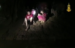 This handout video grab taken from footage released by the Royal Thai Navy late July 2, 2018, shows missing children inside the Tham Luang cave of Khun Nam Nang Non Forest Park in the Mae Sai district of Chiang Rai province.