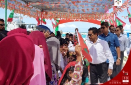 President Abdulla Yameen is warmly received by residents of M. Dhiggaru during his official visit on July 10, 2018. PHOTO/PRESIDENT'S OFFICE