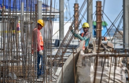Expatriate workers pictured at a construction site in Emboodhoo Lagoon. PHOTO/MIHAARU