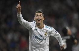 (FILES) In this file photo taken on February 14, 2018 Real Madrid's Portuguese forward Cristiano Ronaldo celebrates after scoring his second goal during the UEFA Champions League round of sixteen first leg football match Real Madrid CF against Paris Saint-Germain (PSG) at the Santiago Bernabeu stadium in Madrid on February 14, 2018.  
Real Madrid announced on July 10, 2018 the transfer of Cristiano Ronaldo to Italy's Juventus, with the Portuguese superstar saying the time had come "for a new stage" in his life. / AFP PHOTO / GABRIEL BOUYS
