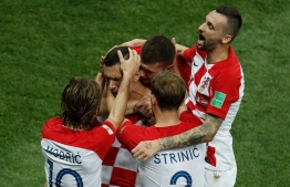 Croatia's forward Ivan Perisic celebrates with teammates after scoring a goal during the Russia 2018 World Cup final football match between France and Croatia at the Luzhniki Stadium in Moscow on July 15, 2018. / AFP PHOTO / Adrian DENNIS / 