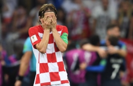 Croatia's midfielder Luka Modric reacts after his team conceded a goal during the Russia 2018 World Cup final football match between France and Croatia at the Luzhniki Stadium in Moscow on July 15, 2018. / AFP PHOTO / Kirill KUDRYAVTSEV / 