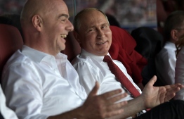 Russian President Vladimir Putin and FIFA president Gianni Infantino attend the Russia 2018 World Cup final football match between France and Croatia at the Luzhniki Stadium in Moscow on July 15, 2018. / AFP PHOTO / SPUTNIK / Alexey NIKOLSKY / 