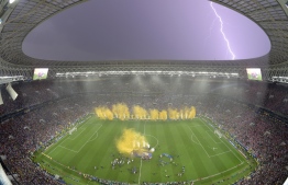 Lightning strikes as France players celebrate after the Russia 2018 World Cup final football match between France and Croatia at the Luzhniki Stadium in Moscow on July 15, 2018. France won the World Cup for the second time in their history after beating Croatia 4-2 in the final in Moscow's Luzhniki Stadium on Sunday. François-Xavier MARIT / AFP
