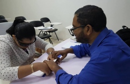 Rasheed teaching the Thaana Braille Course.-- Photo: Thaana Braille FB page