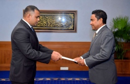 July 25, 2018: President Abdulla Yameen (R) presents the letter of appointment to Ali Nashath, who is appointed to the vacancy on the Elections Commission. PHOTO/PRESIDENT'S OFFICE