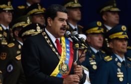 Venezuelan President Nicolas Maduro delivers a speech during a ceremony to celebrate the 81st anniversary of the National Guard in Caracas on August 4, 2018 day in which Venezuela's controversial Constituent Assembly marks its first anniversary.
The Constituent Assembly marks its first anniversary on August 4 as the embodiment of Maduro's entrenchment in power despite an economic crisis that has crippled the country's public services and destroyed its currency. The assembly's very creation last year was largely responsible for four months of street protests that left some 125 people dead.
 / AFP PHOTO / Juan BARRETO