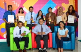 Ooredoo Maldives' CEO Najib Khan (C) poses with other staff for a photograph, after the company won multiple accolades at Asia’s Best Employer Branding Awards 2018. PHOTO/OOREDOO