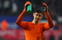 (FILES) In this file photo taken on April 28, 2018 Chelsea's Belgian goalkeeper Thibaut Courtois celebrates their win on the pitch after the English Premier League football match between Swansea City and Chelsea at The Liberty Stadium in Swansea, south Wales.
Real Madrid announced on August 8, 2018 the signing of Belgian international goalkeeper Thibaut Courtois for the next six season, from Chelsea, in a statement on its website. / AFP PHOTO / Geoff CADDICK / RESTRICTED TO EDITORIAL USE. No use with unauthorized audio, video, data, fixture lists, club/league logos or 'live' services. Online in-match use limited to 75 images, no video emulation. No use in betting, games or single club/league/player publications.  / 