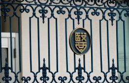 The emblem of the Tokyo Medical University is seen on the building's entance gate in Tokyo on August 8, 2018.
A Tokyo medical school on August 7 admitted entrance test scores for female applicants were routinely altered to keep women out and apologised for the discrimination after a probe. / AFP PHOTO / Kazuhiro NOGI