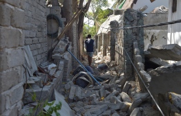 A man walks through rubble of buildings on Gili Air island, West Nusa Tenggara on August 11, 2018, following the August 5 earthquake on the Indonesian island of Lombok.
The shallow 6.9-magnitude quake on August 5 levelled tens of thousands of homes, mosques and businesses across Lombok. / AFP PHOTO / Adek BERRY