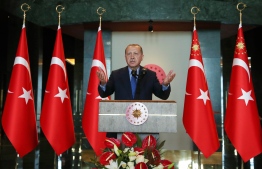 This handout photo taken and released on August 13, 2018 by the Turkish Presidential Press Service shows Turkish President Recep Tayyip Erdogan addressing a luncheon for participants of the 10th Ambassadors' Conference at the Presidential Complex in Ankara.
Erdogan on August 13 accused the United States of seeking to stab Turkey "in the back" over a diplomatic row sparked by the detention of an American pastor that has sent the lira into a tailspin. "You act on one side as a strategic partner but on the other you fire bullets into the foot of your strategic partner," Erdogan told a conference in the capital Ankara. / AFP PHOTO / TURKISH PRESIDENTIAL PRESS SERVICE / KAYHAN OZER /