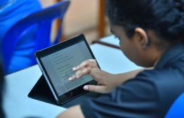 A student seen utilizing a tablet distributed by the Ministry of Education under its 'School Digitization Programme'. PHOTO: HUSSAIN WAHEED / MIHAARU