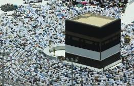 Muslim worshippers pray around the Kaaba, Islam's holiest shrine, at the Grand Mosque in Saudi Arabia's holy city of Mecca on August 16, 2018, prior to the start of the annual Hajj pilgrimage in the holy city.
Muslims from across the world are gathering in Mecca in Saudi Arabia for the annual hajj pilgrimage, one of the five pillars of Islam.  / AFP PHOTO / AHMAD AL-RUBAYE