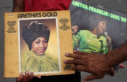 A fan holds up albums outside the New Bethel Baptist Church to pay his respects to the late Aretha Franklin in Detroit, Michigan on August 18, 2018.
The funeral for legendary singer Aretha Franklin will be held on August 31 in her hometown Detroit, after a two-day public viewing period, local media reported, citing family sources.Franklin, 76, died Thursday following a battle with pancreatic cancer.  / AFP PHOTO / TIMOTHY A. CLARY