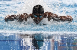 India's Sajan Prakash competes in a heat of the menís 100m butterfly swimming event during the 2018 Asian Games in Jakarta on August 22, 2018. / AFP PHOTO / Jewel SAMAD / ìThe erroneous mention[s] appearing in the metadata of this photo by Jewel SAMAD has been modified in AFP systems in the following manner: [India's Sajan Prakash]. Please immediately remove the erroneous mention[s] from all your online services and delete it (them) from your servers. If you have been authorized by AFP to distribute it (them) to third parties, please ensure that the same actions are carried out by them. Failure to promptly comply with these instructions will entail liability on your part for any continued or post notification usage. Therefore we thank you very much for all your attention and prompt action. We are sorry for the inconvenience this notification may cause and remain at your disposal for any further information you may require.î