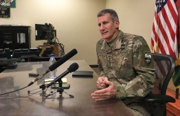 (FILES) In this file photo taken on March 14, 2018 General John Nicholson, who leads US and NATO forces in Afghanistan, speaks to reporters at Bagram Air Base, about 60km north of the Afghan capital Kabul.
The top commander for US and NATO forces in Afghanistan said August 22, 2018 that warring parties now have an "unprecedented" opportunity for peace, and insisted President Donald Trump's strategy for the beleaguered country is working."We have an unprecedented opportunity, or window of opportunity, for peace right now," said General John Nicholson, the outgoing commander of NATO's Resolute Support mission.
 / AFP PHOTO / Thomas WATKINS