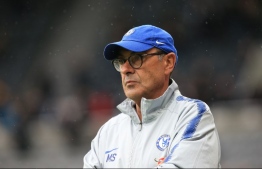 Chelsea's Italian head coach Maurizio Sarri is seen before kick off of the English Premier League football match between Newcastle United and Chelsea at St James' Park in Newcastle-upon-Tyne, north east England on August 26, 2018. / AFP PHOTO / Lindsey PARNABY / RESTRICTED TO EDITORIAL USE. No use with unauthorized audio, video, data, fixture lists, club/league logos or 'live' services. Online in-match use limited to 120 images. An additional 40 images may be used in extra time. No video emulation. Social media in-match use limited to 120 images. An additional 40 images may be used in extra time. No use in betting publications, games or single club/league/player publications. / 