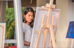 The KULA art initiative was launched on the 5th of October 2017, by Kandima Maldives.Picture shows resident (local) artist Aima Mustafa, who paints and creates art at the resort. PHOTO: KANDIMA MALDIVES.