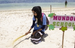September 1, 2018, L.Maabaidhoo : A student poses with her prop before a performance at the Laamu Turtle Festival 2018. PHOTO: HAWWA AMAANY ABDULLA / THE EDITION