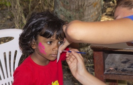 September 1, 2018, L. Maabaidhoo: A child at the face painting stall at the Laamu Turtle Festival 2018. PHOTO: HAWWA AMAANY ABDULLA / THE EDITION