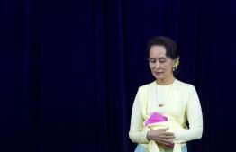 Myanmar State Counsellor Aung San Suu Kyi leaves after delivering address before students of Yangon University general assembly in Yangon on August 28, 2018.
The address was Aung San Suu Kyi's first public appearance after Facebook banned Myanmar's army chief and other top military brass on August 27 after a UN investigation recommended they face prosecution for genocide for a crackdown on Rohingya Muslims. / AFP PHOTO / YE AUNG THU